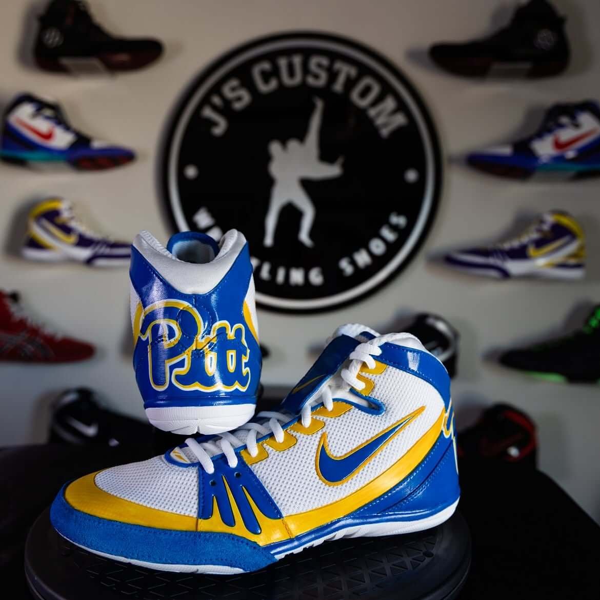 Custom hand-painted wrestling shoes in University of Pittsburgh blue and yellow